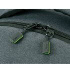Close-up of a dark gray backpack with a zipper partially open, revealing two black zipper pulls with green edges. The zipper pulls have a small, embossed text and are attached to the main compartment of the bag.