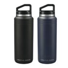 Two insulated water bottles side by side on a white background. The bottle on the left is black and the one on the right is dark gray. Both have a logo at the bottom and black caps with a carrying handle.