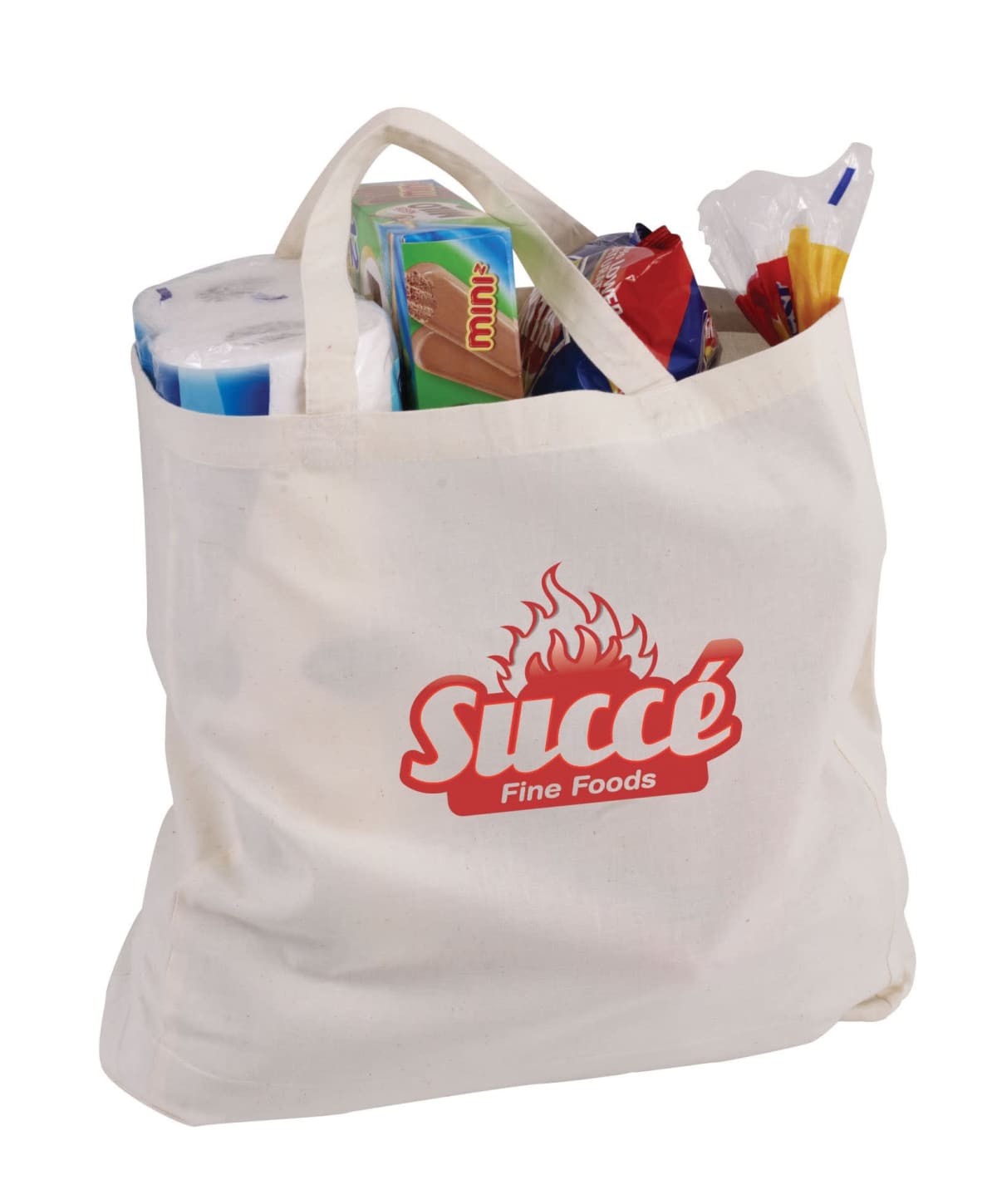 A canvas tote bag filled with various groceries, including toilet paper, a chocolate bar, a loaf of bread, and pasta. The bag features a red Succé Fine Foods logo with a flame design.