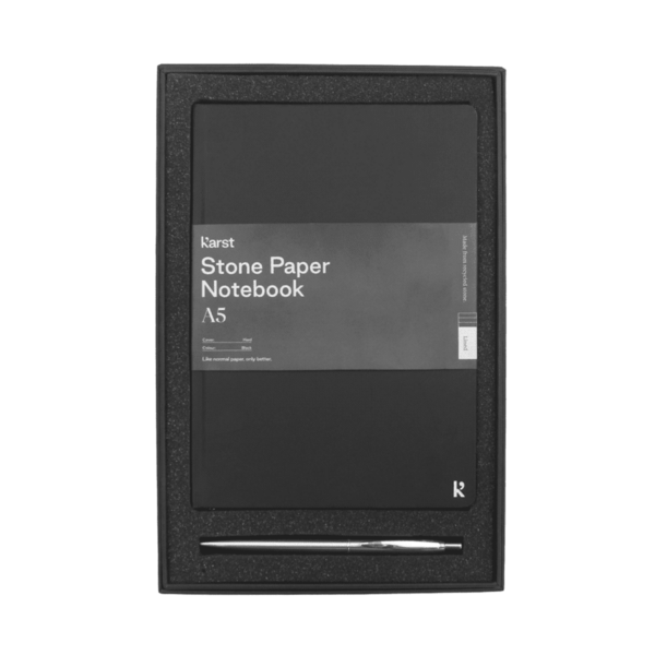 A black A5 stone paper notebook and a silver pen in a black presentation box.