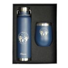 A gift set featuring a blue insulated bottle and a tumbler, both branded with Family Healthcare Services on a dark background. The name Olivia is engraved on the bottle. The set is neatly arranged in a box.
