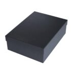 A closed, rectangular black box with a lid, placed on a white background. The box has a smooth texture and a matte finish.