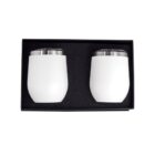 Two white stainless steel tumblers with steel lids are placed side by side in a black foam-lined box. The tumblers are designed for insulating beverages and are suitable for travel or everyday use.