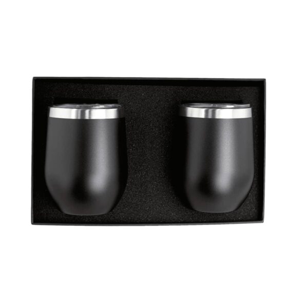 Two black, stainless steel tumblers with silver rims are placed side by side in a black foam-lined box.
