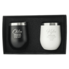 A black and a white insulated cup set in a box. The black cup reads, Chloe, Cappuccino, Almond Milk, Extra Shot. The white cup reads, Kylee, Cappuccino, Full Cream Milk, 2 Sugars, Warm.
