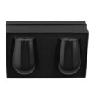 Two black stemless wine glasses sit in a black rectangular gift box with foam padding.
