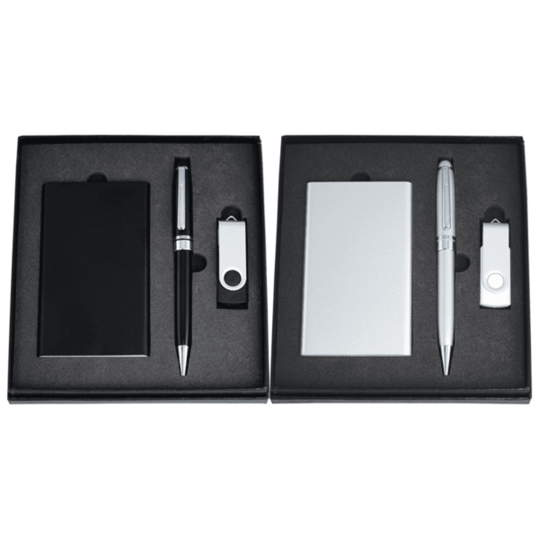 Two black boxes containing a pen, a rectangular card holder, and a USB flash drive. One set is black, and the other is silver. The items are neatly arranged in foam compartments.