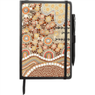Notebook with a colorful Indigenous Australian dot art cover featuring abstract patterns in brown, cream, red, and orange. It includes a black pen attached to the side and an elastic band.