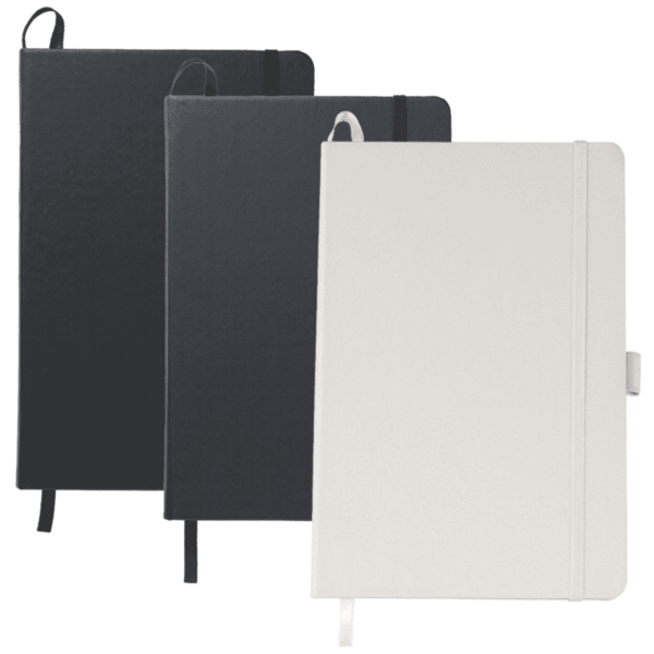 Three notebooks standing vertically: one black with a black elastic band, one dark gray with a black elastic band, and one white with a white elastic band. Each has a ribbon bookmark.