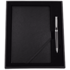 A black notebook and a black and silver pen are elegantly presented in a black gift box with compartments.