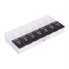 A weekly pill organizer with seven black compartments labeled with days of the week and pm for evening doses: SAT, FRI, THU, WED, TUE, MON, and SUN, with an Olivia Bloom logo on the front.