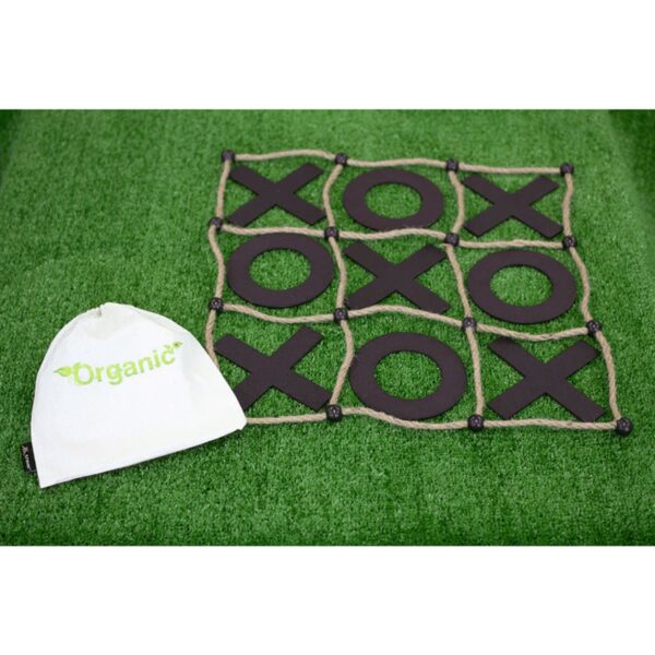 A tic-tac-toe board with black Xs and Os rests on a grass surface. Next to it is a white drawstring bag with the word Organic in green.