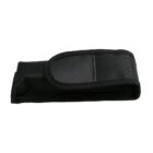 A black fabric pouch with a flap closure, likely for holding a small tool or device. The material appears textured, suggesting durability, and the flap is secured with a hook-and-loop fastener.