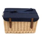 A wicker picnic basket with a navy blue fabric lid and handle. Brown leather straps with buckles secure the lid, and the baskets weave is visible.