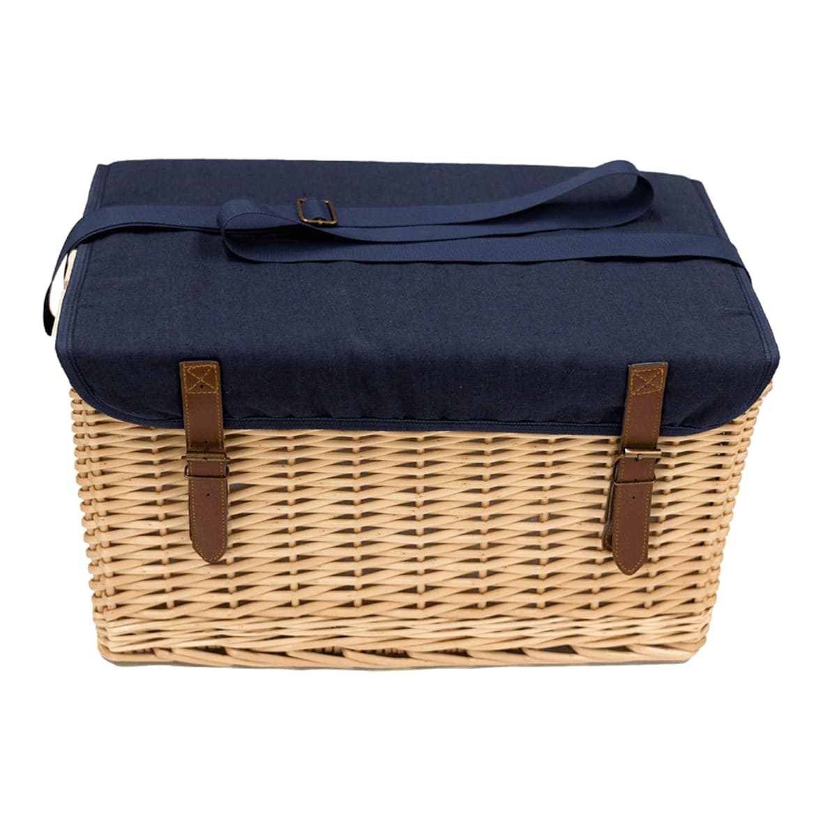 A wicker picnic basket with a navy blue fabric lid and handle. Brown leather straps with buckles secure the lid, and the baskets weave is visible.
