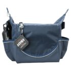 A blue fabric messenger bag with two side pockets. One pocket holds a black water bottle. The bag has a front zipper and a flap. A square keychain with a logo hangs from the zipper pull.
