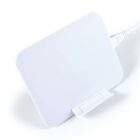 White wireless charging pad with an attached cable on a white background.