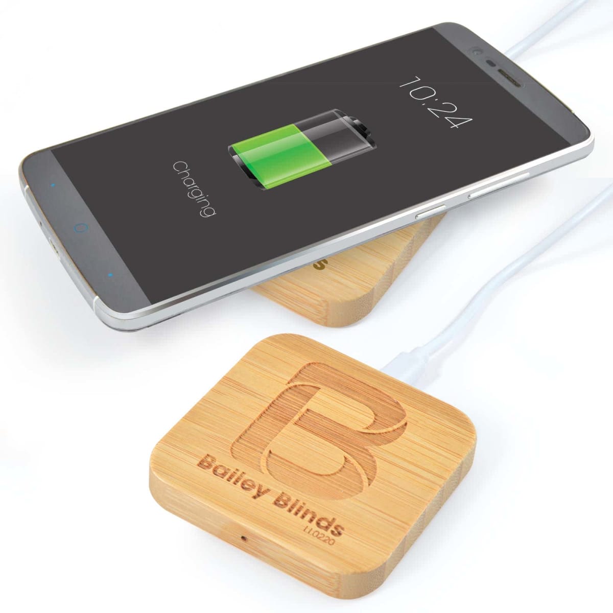 Phone charging on a wooden wireless charger with Bailey Blinds logo.