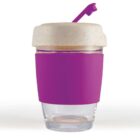 Reusable cup with purple silicone sleeve and lid, featuring a flip-top spout.
