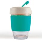 Reusable cup with teal sleeve and straw, clear bottom, and beige lid.