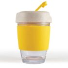 Clear tumbler with a yellow sleeve, beige lid, and yellow straw.