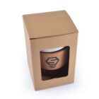Cardboard box with a cutout, displaying a branded glass cup inside.