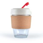Glass cup with a cork sleeve, white lid, and red straw.