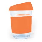 Glass cup with an orange lid and sleeve.