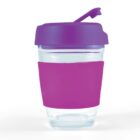 Clear travel mug with a purple lid and sleeve, featuring a flip-top spout.