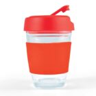 Clear glass cup with a red lid and sleeve.