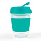Clear cup with turquoise lid and sleeve, featuring a flip-top spout.