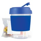 Blue snack container with a flip-top lid, accompanied by a bag of candies.