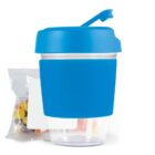 Blue container with a transparent base and a pack of colorful candies beside it.