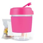Pink and clear container with a snack pouch of colorful candy behind it.