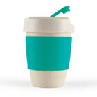 Eco-friendly reusable cup with a turquoise band and lid, featuring a spoon attachment.