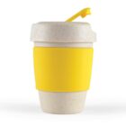 Reusable cup with a speckled texture and a yellow sleeve and lid.