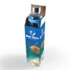 Glass bottle with blue sleeve in an ocean-themed box featuring a sea turtle design.