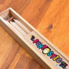 Wooden pencil box with colored pencils inside, labeled Funtastic Stay Sharp.