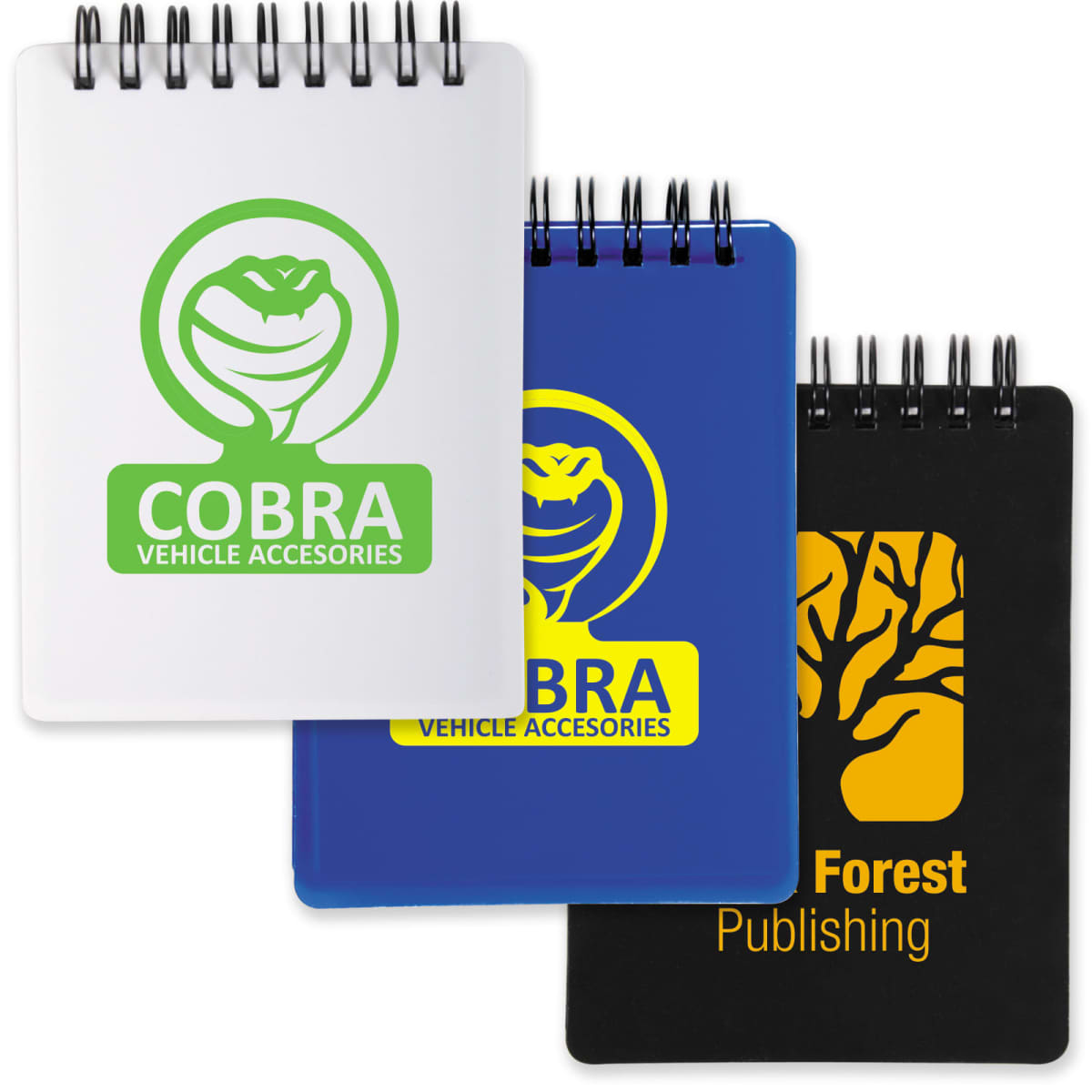 Three spiral notepads: white and blue with Cobra Vehicle Accessories logo, black with Forest Publishing logo.