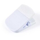 White plastic chip clip on a white background.