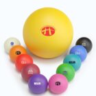 A large yellow exercise ball surrounded by smaller, colorful balls in a V formation.