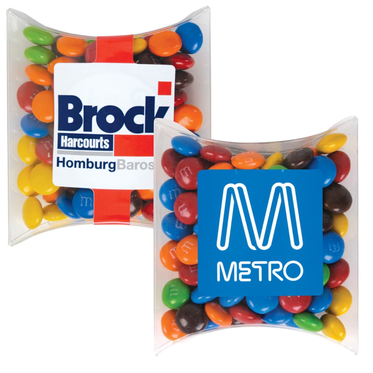 Two pillow-shaped packs of colorful candies with Brock and Metro logos on them.