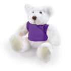 A white teddy bear wearing a purple shirt sitting upright on a plain white background.