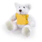 A white teddy bear wearing a yellow shirt sitting upright on a plain white background.