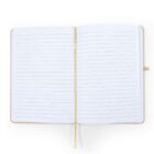 Open notebook with lined pages and a beige cover, resting on a flat surface. A thin, light brown ribbon bookmark lies across the center of the pages, vertically aligned. The pages are blank and ready for writing.