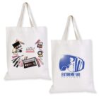 Two white tote bags: the first bag features cosmetics, brushes, and the text Lush Cosmetics; the second bag displays a ski-themed design with Extreme Ski Perisher and a silhouette of a person skiing.
