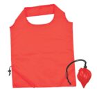 A bright red reusable shopping bag with a thick handle next to a small pouch for storage. Both items are made of the same red fabric. The bag has a drawstring corner for compact folding.
