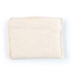 A folded, off-white canvas bag lies flat against a white background. The bag has a simple design with visible stitching along the edges.
