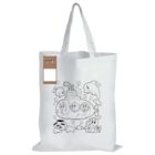 A white tote bag features a black outline drawing of an underwater scene with a submarine, three people inside, playful dolphins, fish, and bubbles around. Theres a brown paper tag hanging from one handle.