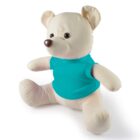 A cream-colored plush teddy bear wearing a bright teal shirt, sitting upright with its legs extended and arms slightly forward. Its ears are perked up, and it has a round nose and friendly expression.